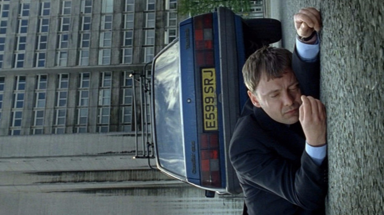 Sam (John Simm) lies next to his car in Life on Mars