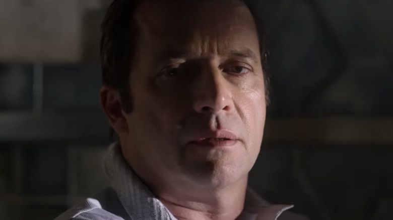 A man stares ominiously forward
