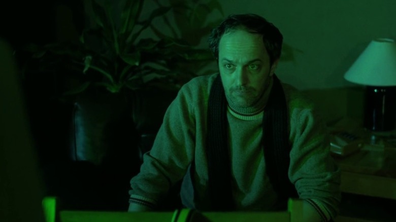 Krzysztof sitting in front of a green computer screen on Dekalog S1E1