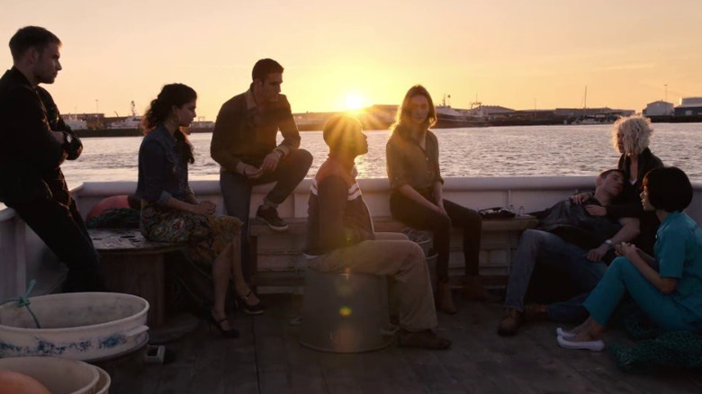 The eight sensates sitting together on a boat on Sensate S1E12