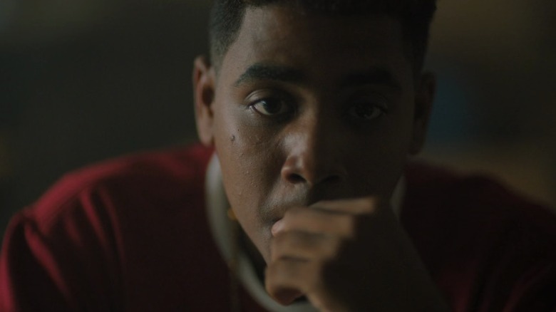 Korey Wise thinking with his hand on his mouth on When They See Us S1E1