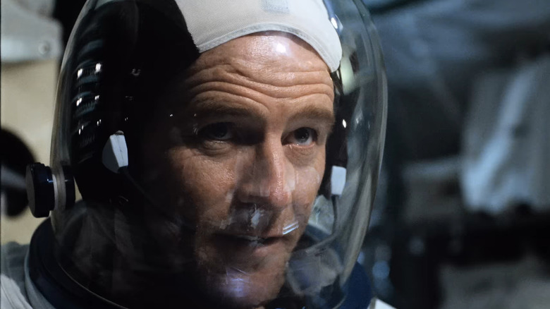 Bryan Cranston as Buzz Aldrin in spacesuit in From Earth to the Moon
