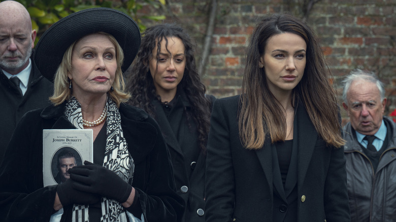 Judith and Maya standing at a funeral