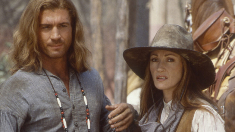 Byron Sully (Joe Lando) and Michaela Quinn (Jane Seymour) stand by a horse in Dr Quinn, Medicine Woman