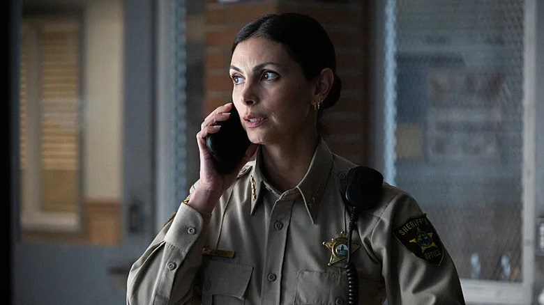 Mickey Fox (Morena Baccarin) talks on a phone in Sheriff Country