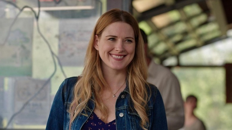 Mel Monroe (Alexandra Breckenridge) smiles on a porch in Virgin River