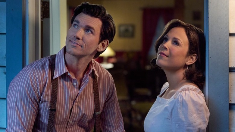 Nathan Grant (Kevin McGarry) and Elizabeth Thatcher (Erin Krakow) gaze at the sky from their porch in When Calls the Heart
