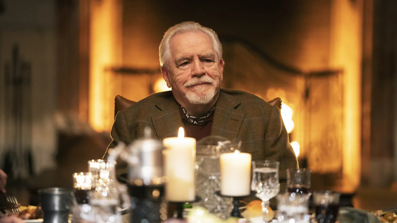 Brian Cox as Logan Roy, sitting at the head of a table in Succession