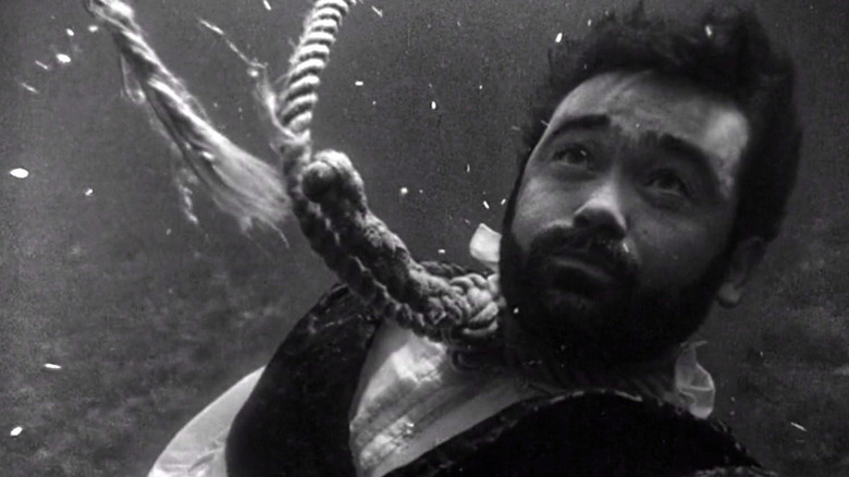 Peyton Farquhar (Roger Jacquet) stares up underwater with a broken noose around his neck in The Twilight Zone (1959)