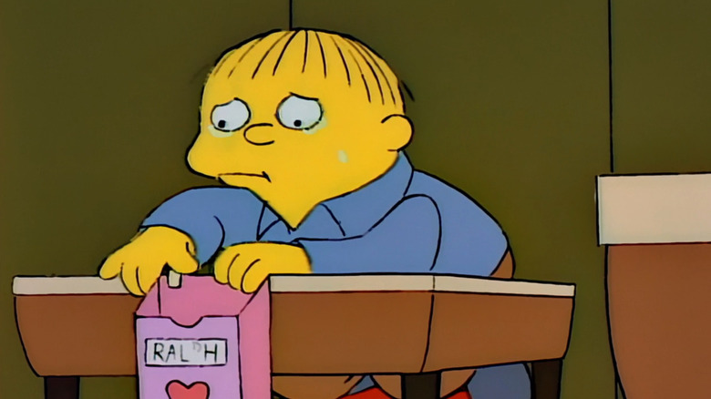Ralph Wiggum cries holding valentine box
