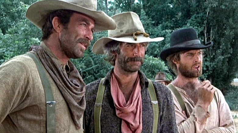 Orrin Sackett (Tom Selleck), Tell Sackett (Sam Elliott), and Tyrel Sackett (Jeff Osterhage) stand in a row in The Sacketts