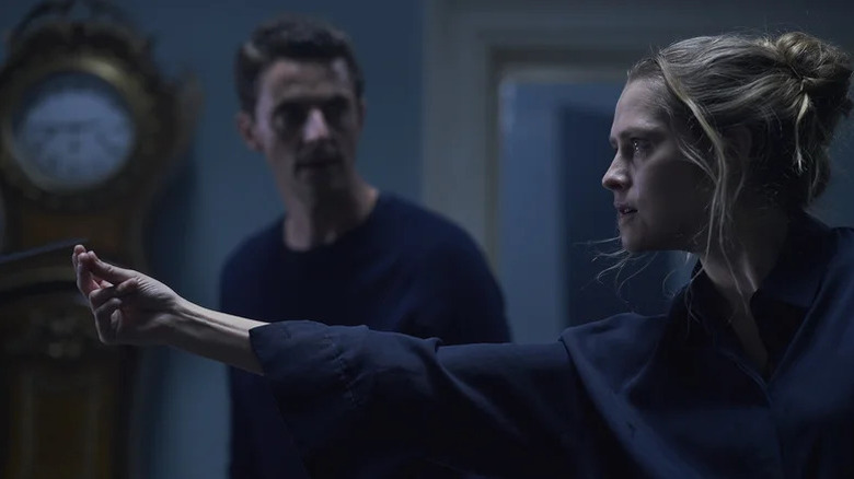 Teresa Palmer's Diana Bishop extending her hand and looking intense on A Discovery of Witches