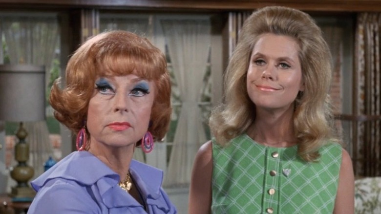 Agnes Moorehead's Endora looking unimpressed and Elizabeth Montgomery's Samantha Stephens smiling on Bewitched