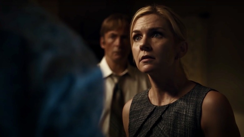 Rhea Seehorn as Kim Wexler on Better Call Saul, with Bob Odenkirk as Saul Goodman in the background behind her