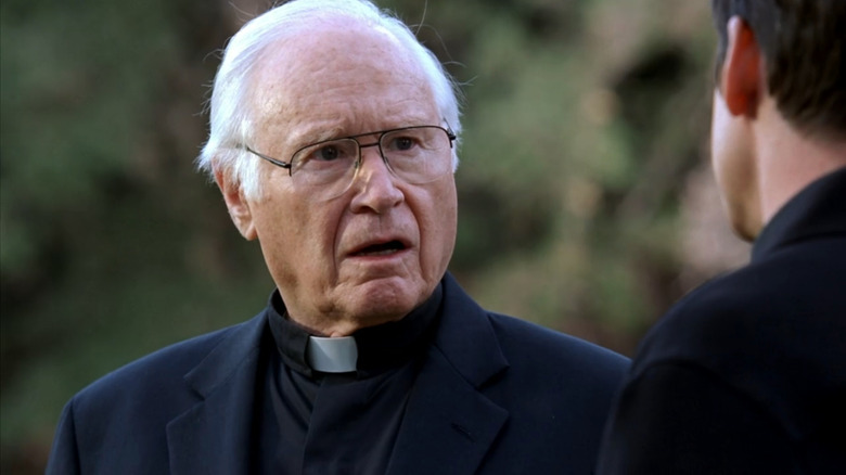 Father William Donlan (George Coe) looking shocked in Bones