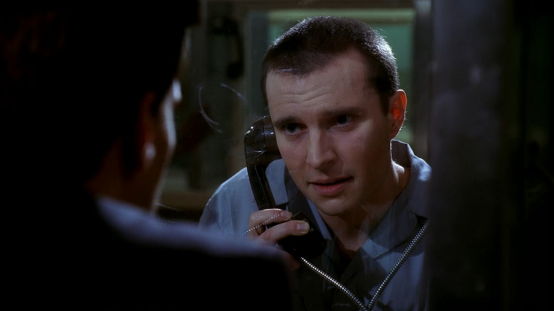 Howard  (Heath Freeman) speaking on the phone in jail in Bones