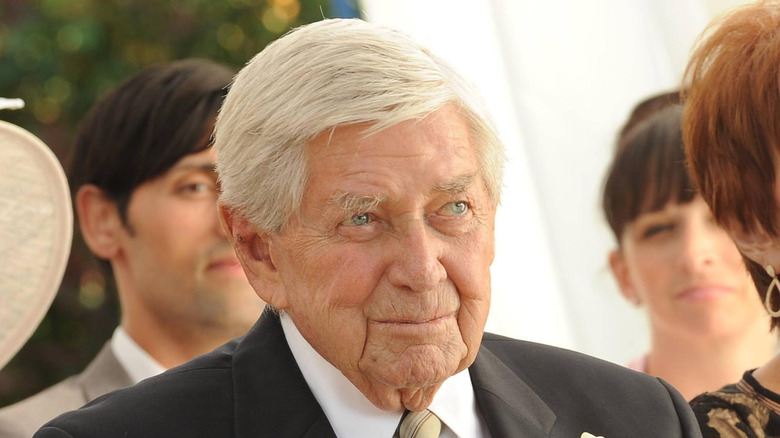 Hank (Ralph Waite) smiling at a wedding in Bones