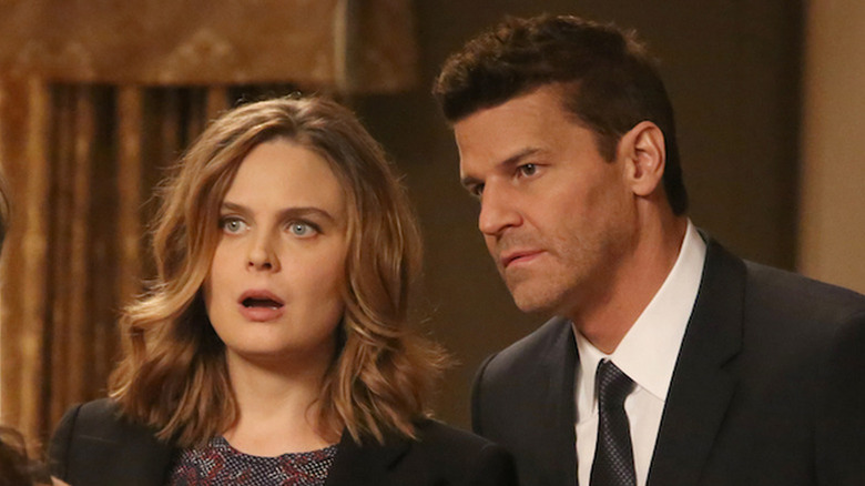 Brennan (Emily Deschanel) and Booth (David Boreanaz) standing next to each other on "Bones."