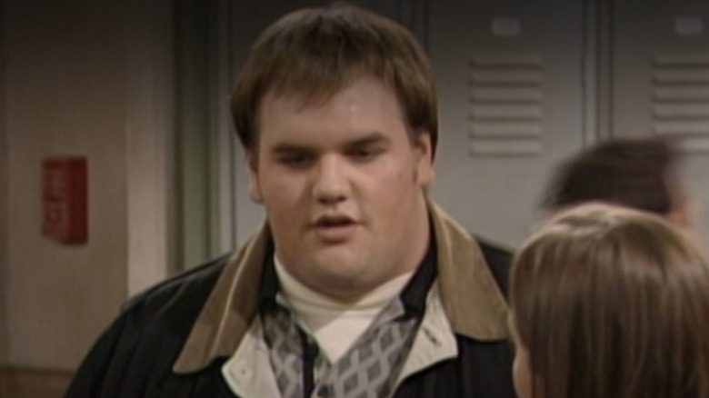 Ethan Suplee as Frankie Stechino talking to Blake Sennett as Joey the Rat in the school hallway in Season 4 of Boy Meets World