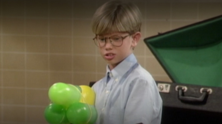 Lee Norris as Stuart Minkus holding a water gun in Season 1 of Boy Meets World