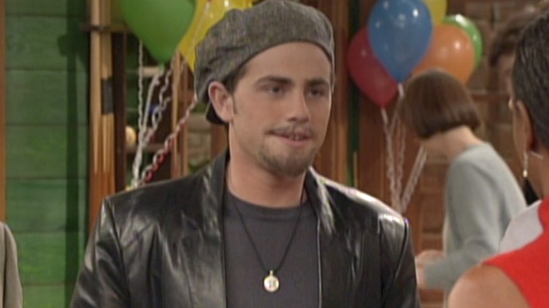 Rider Strong as Shawn Hunter smiling in Cory's room in Season 6 of Boy Meets World