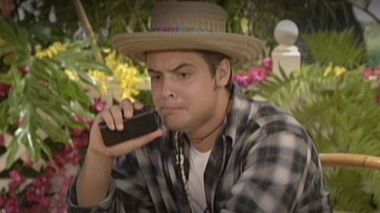 Will Friedle as Eric Matthews wearing a hat and using a tape recorder in Season 7 of Boy Meets World