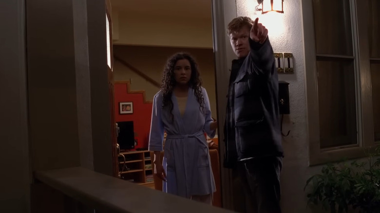 Emily Rios as Andrea Cantilloand Jesse Plemons as Todd Alquist, standing in her doorway in Breaking Bad.