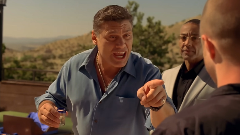 Steven Bauer as Don Eladio Vuente, talking to Jesse and Gus while holding a tequila shot in Breaking Bad.