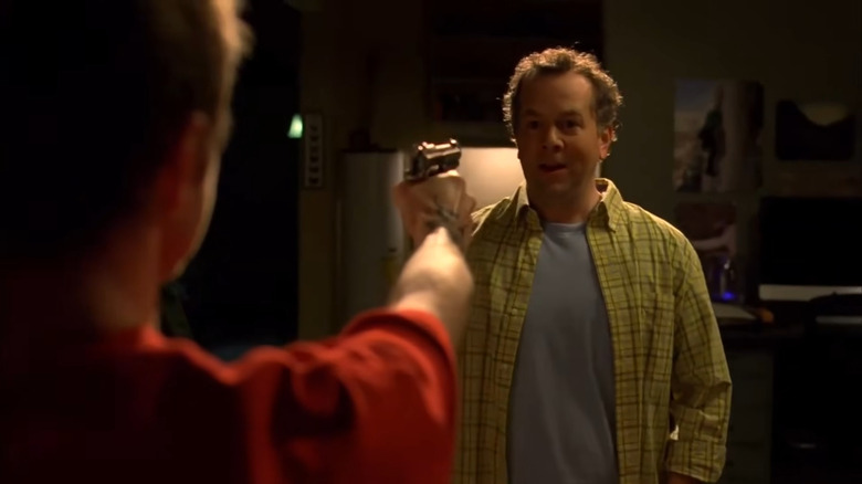 David Costabile as Gale Boetticher, held at gun point by Jesse in Breaking Bad.