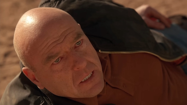 Dean Norris as Hank Schrader, lying on his side in Breaking Bad.