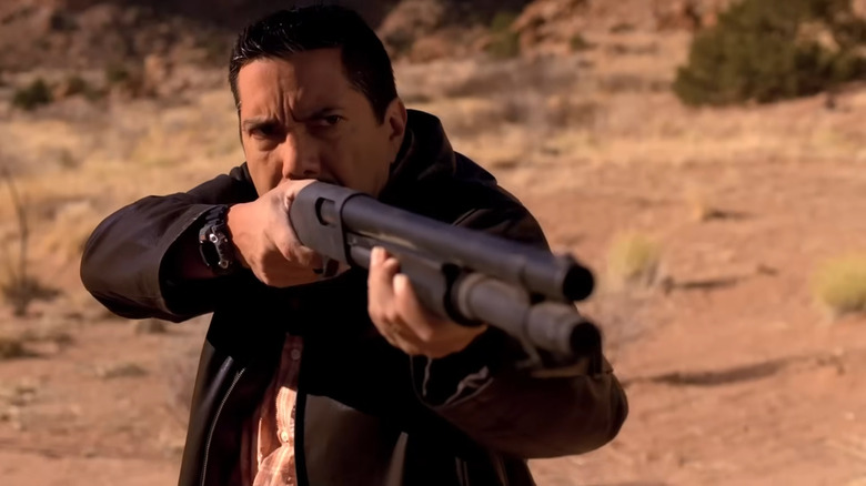 Steven Michael Quezada as Steve Gomez, holding a shotgun in Breaking Bad.