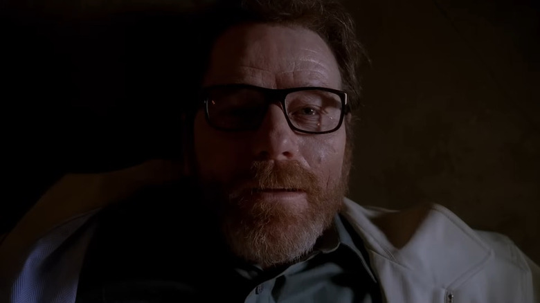 Bryan Cranston as Walter White, lying on his back with a smile in Breaking Bad.