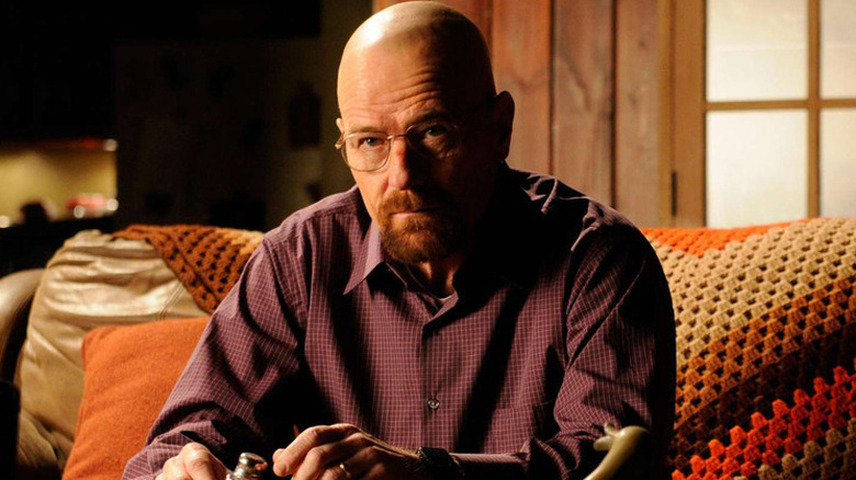 Walter White (Bryan Cranston) sitting on a sofa on "Breaking Bad"