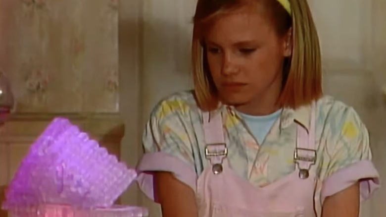 Evie Ethel Garland speaking with her alien father Troy via the Cube in "Out of This World."