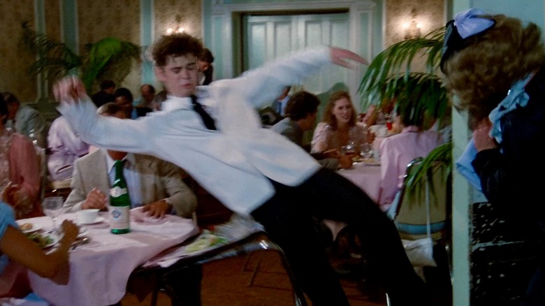 C. Thomas Howell as a busboy falling on restaurant table