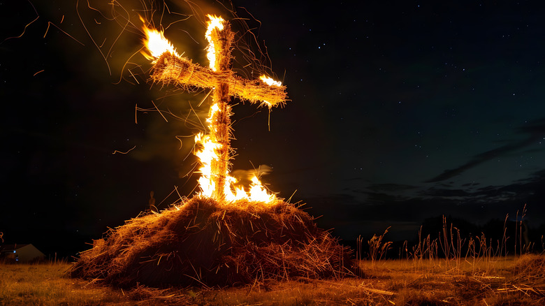 Burning straw cross at night