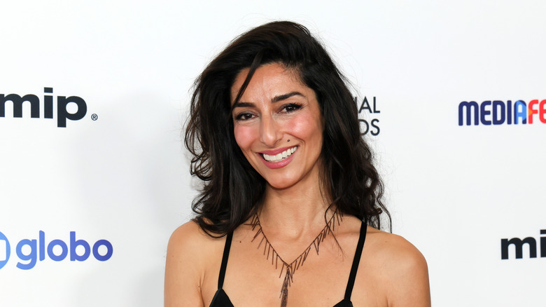Necar Zadegan smiles as she poses for photographers