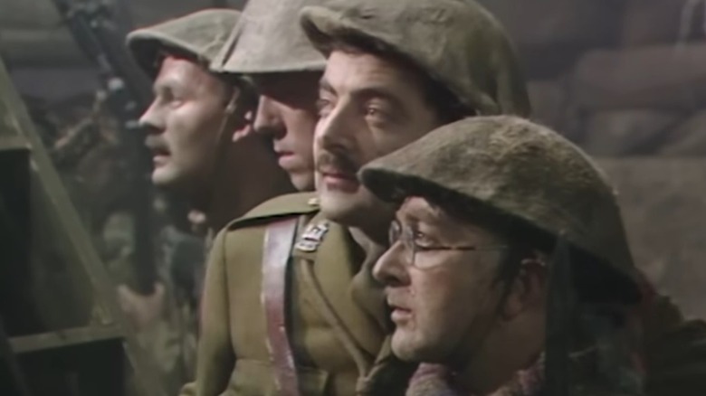 Tim McInnerny, Hugh Laurie, Rowan Atkinson, and Tony Robinson in their final moments, looking on