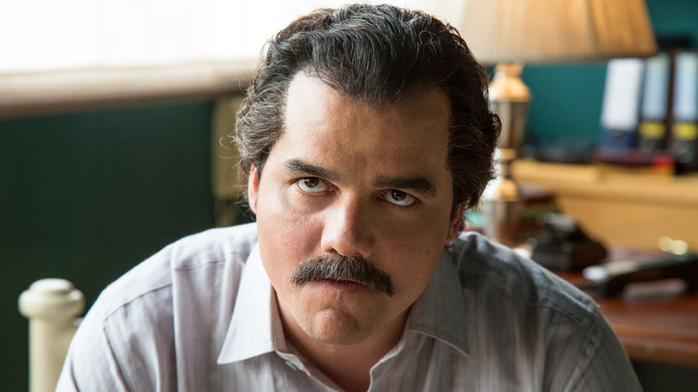Pablo Escobar (Wagner Moura) glares upwards in Narcos