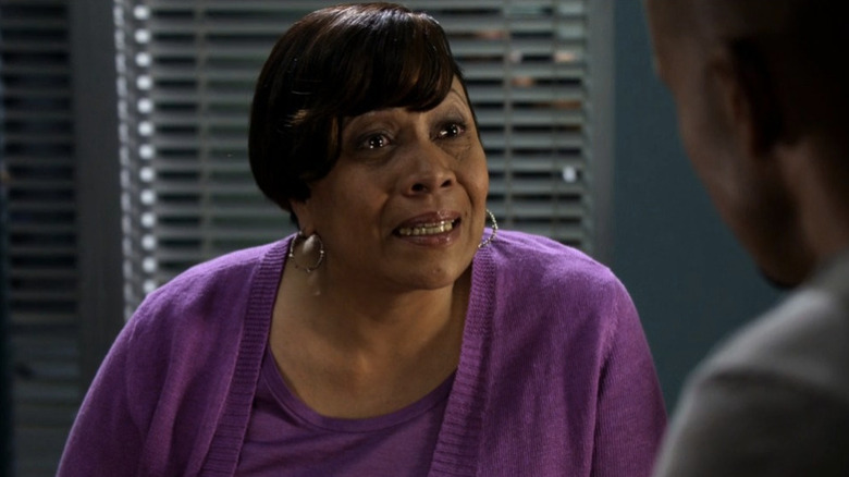 Yvonne Burns tearfully talking to Derek Morgan across the table in "Criminal Minds" (2005-present)