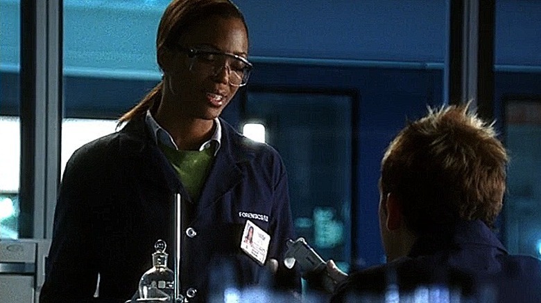 Mia Dickerson having a conversation in the forensics lab