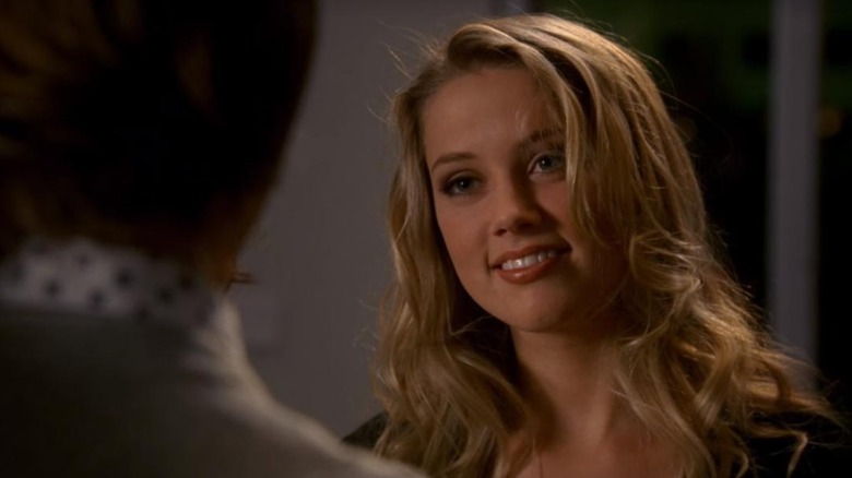 Amber Heard as Lila Archer, smiling at Spencer Reid on Criminal Minds.