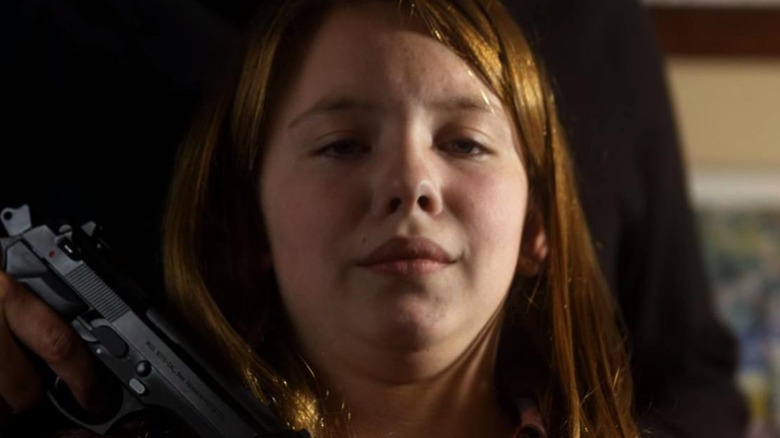 Sydney Sweeney as Dani Forester, crying at gunpoint on Criminal Minds.