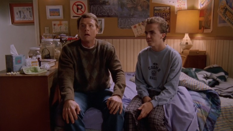 Hal and Malcolm sitting side by side on Malcolm's bed in Malcolm in the Middle