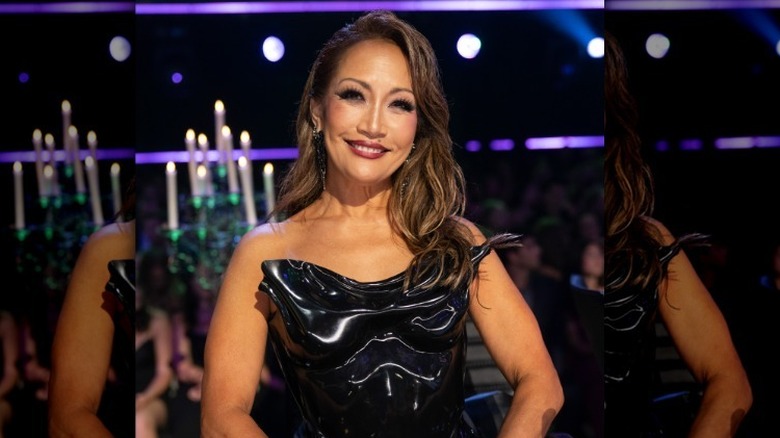 Carrie Ann Inaba posing in a black dress