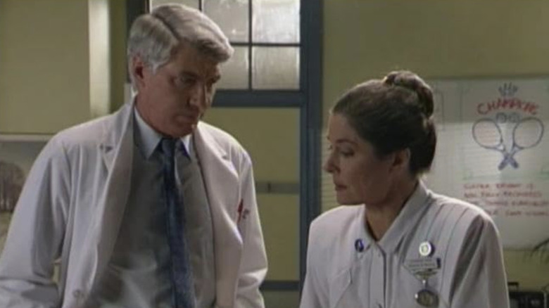 Shane Porteous as Dr. Terence Elliott talking to Maureen Edwards as Rosemary Prior on A Country Practice