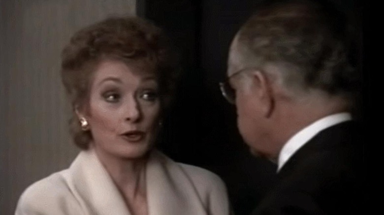 Rosalind Shays speaking to Leland McKenzie moments before falling to her death down an elevator shaft