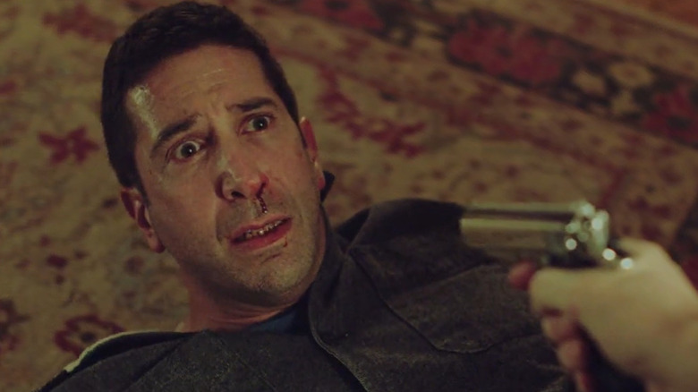 David Schwimmer as Tommy Moran looking concerned in "Feed the Beast."
