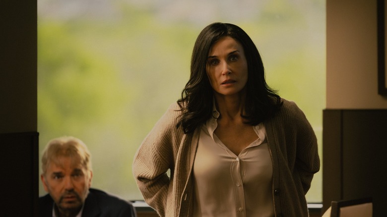 Demi Moore as Cami, with Billy Bob Thornton as Tommy behind her, in Landman Season 1