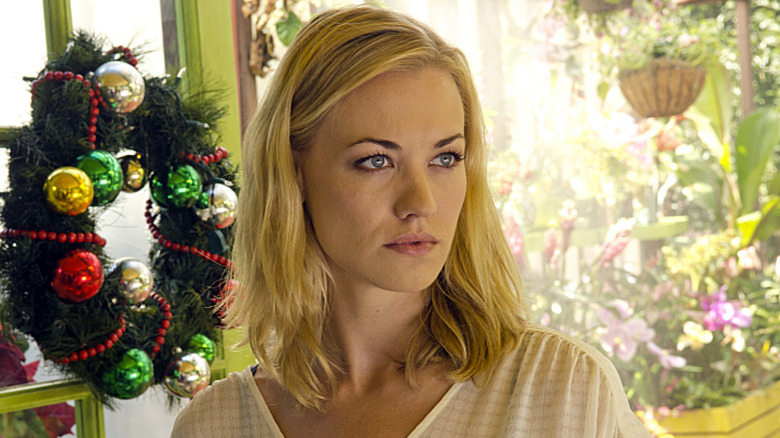 Yvonne Strahovski as Hannah McKay, scowling in a garden in Dexter.